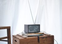 modern radio set placed on wooden crate