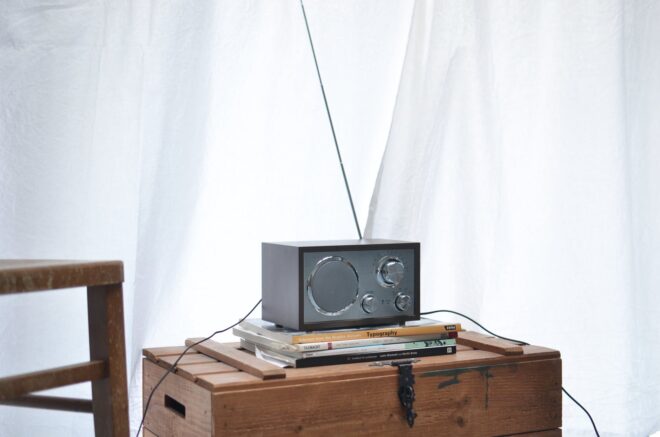 modern radio set placed on wooden crate